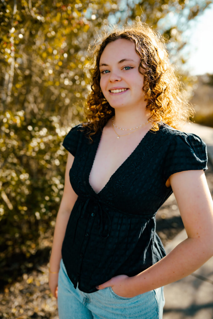 color photo of a girl walking along a path at the beach on Topsail Island, NC
