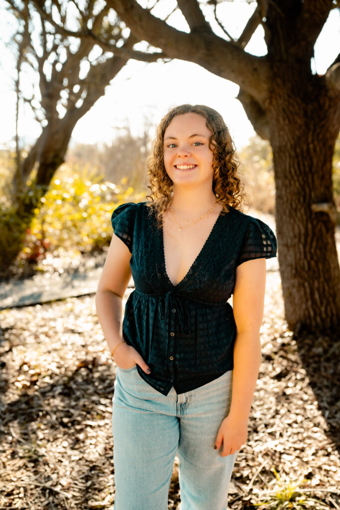 color photo of a girl stopped along a path at the beach at Topsail Island, NC