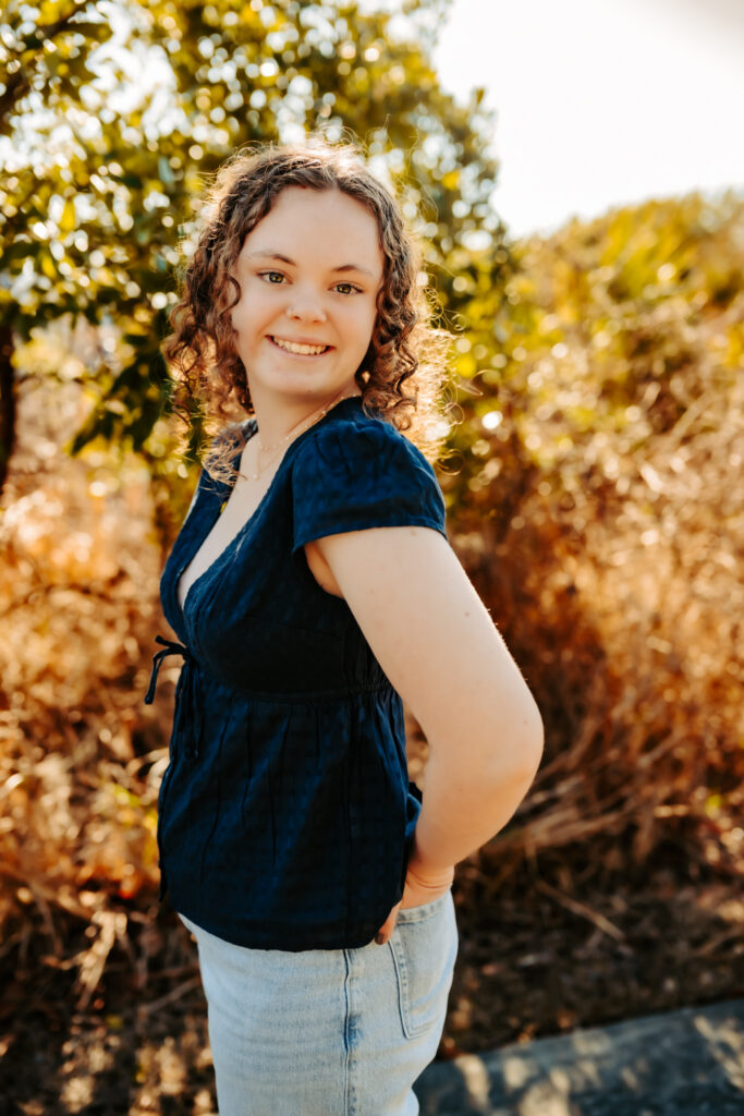 Girls standing along a path near a tree on Topsail Island