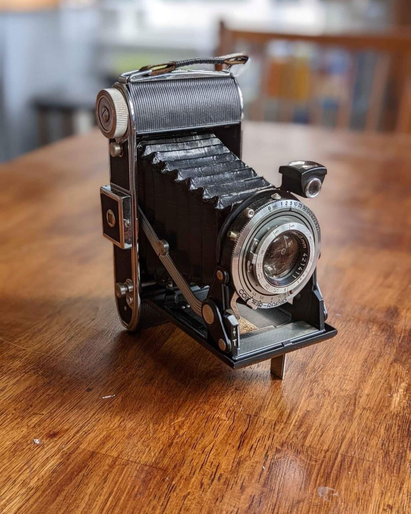 photograph of an old vintage camera on a table