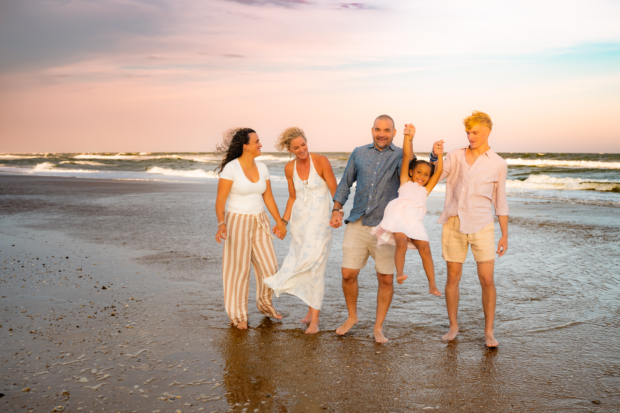Color family photo on the beach walking together