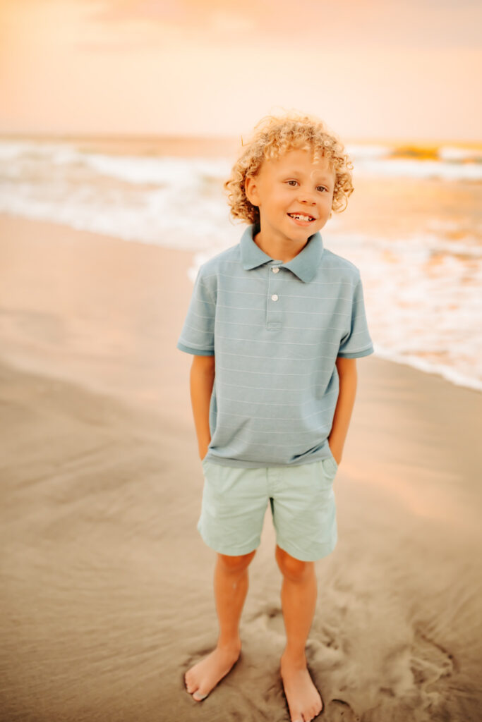 color photo of boy on the beach